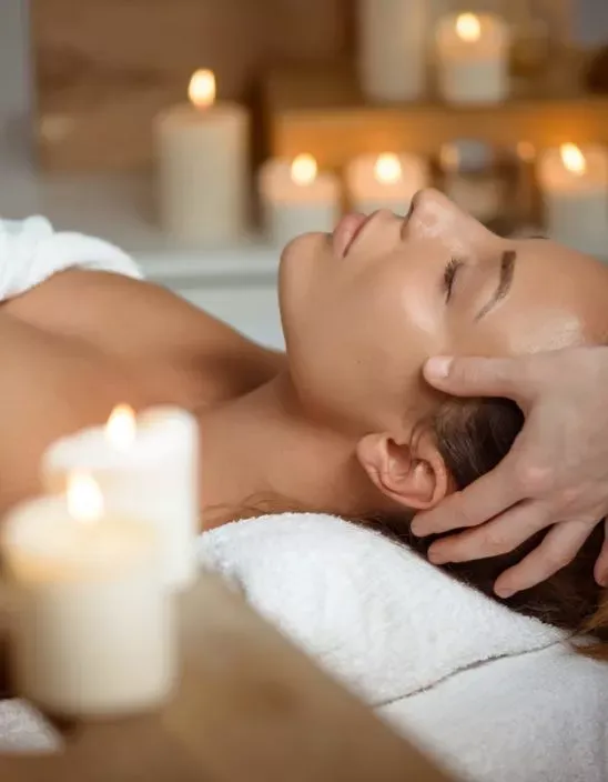 Young Beautiful Girl Having Face Massage Relaxing In Spa Salon.